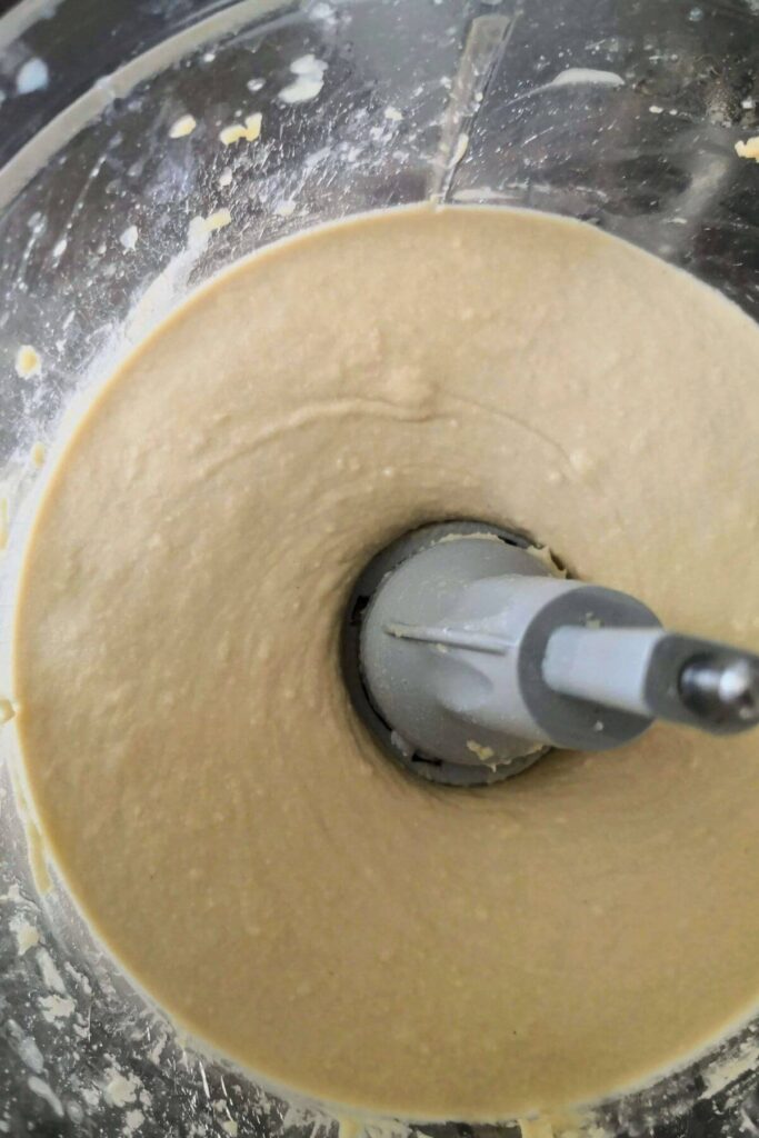 Creamy oil free hummus after blending in the food processor bowl