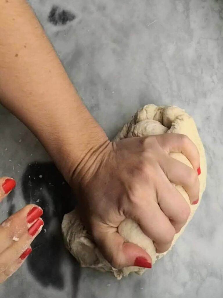 Hand kneading the easy soft flatbread dough.