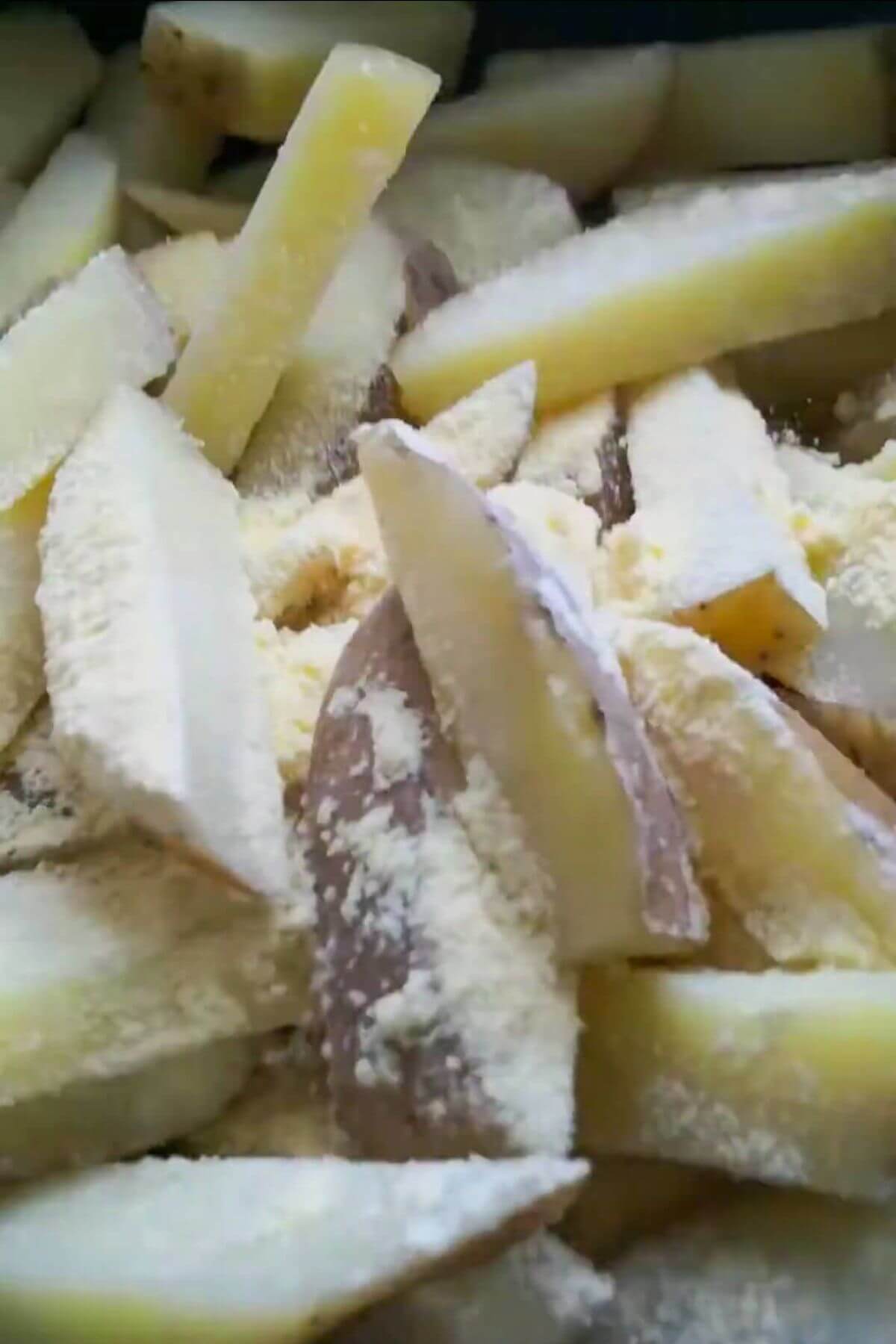 Close up of chips after being tossed in polenta.
