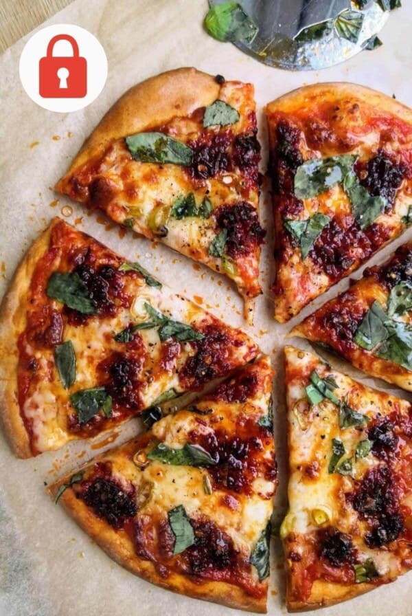 Nduja and cheese pizza baked and sliced.
