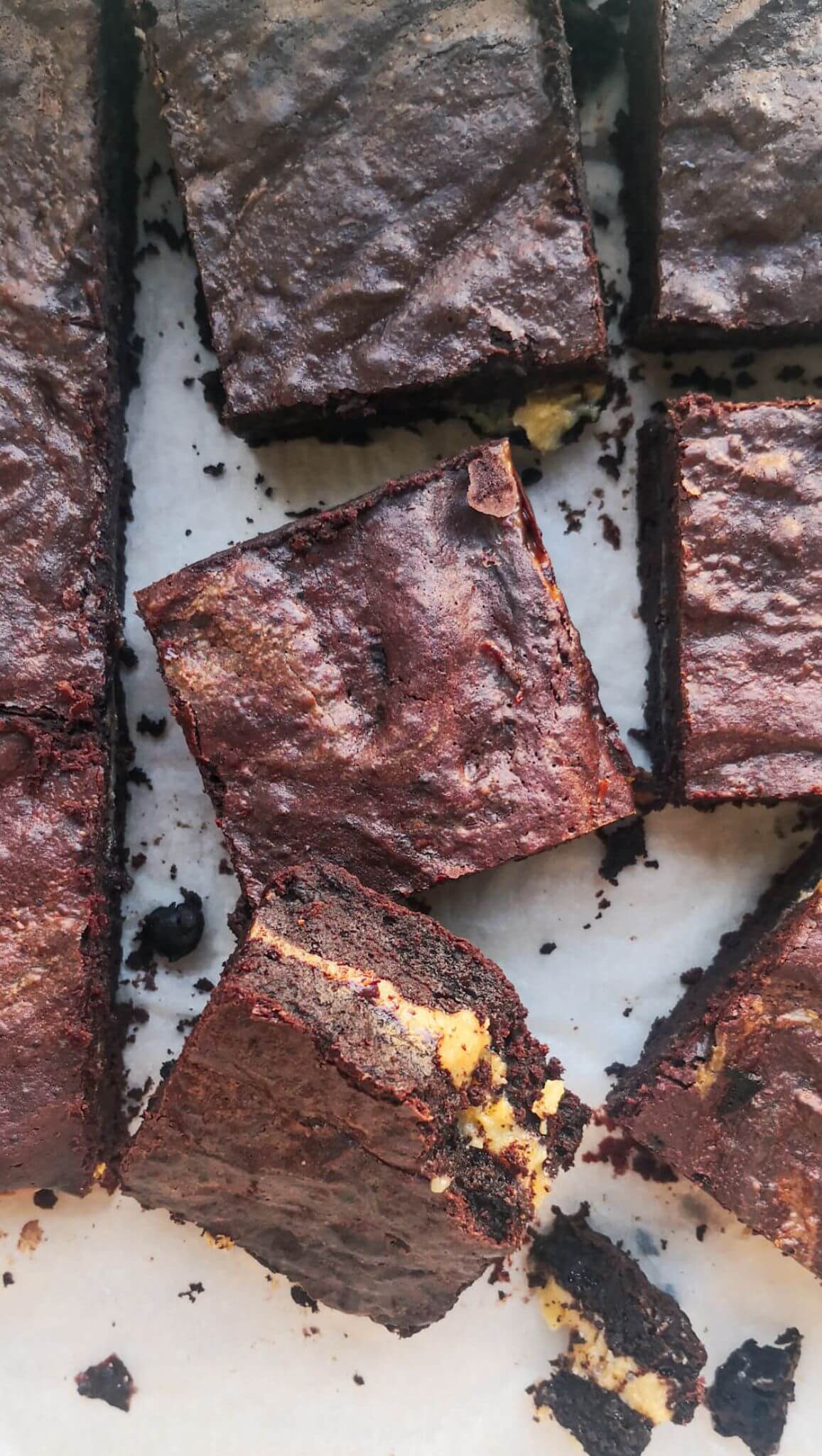 6 pieces of salted caramel brownies on a flat surface.