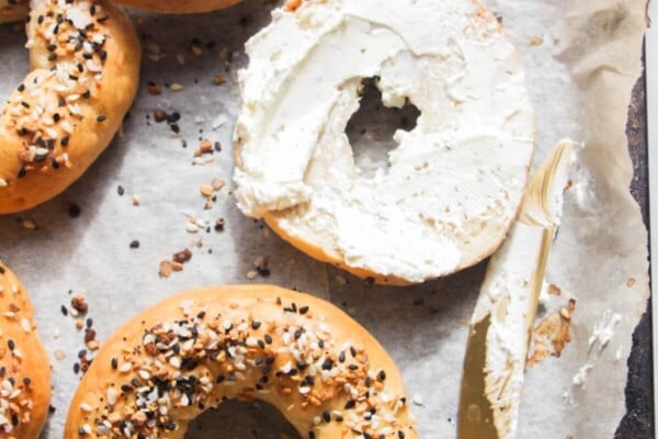 2 ingredient Greek yogurt bagels on a lined oven tray.