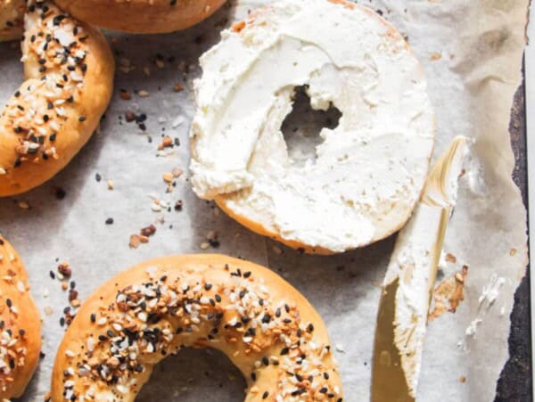 2 ingredient Greek yogurt bagels on a lined oven tray.