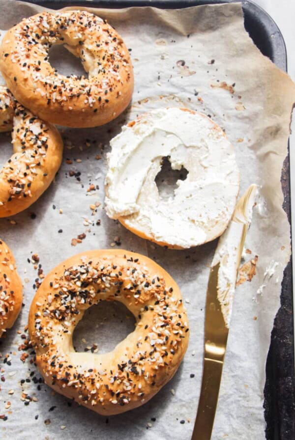 2 ingredient Greek yogurt bagels on a lined oven tray.
