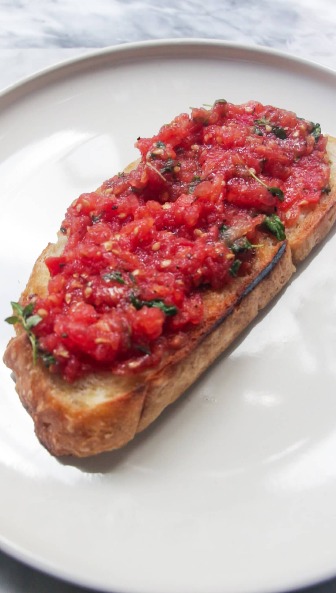 Grated tomato mix on toasted bread.
