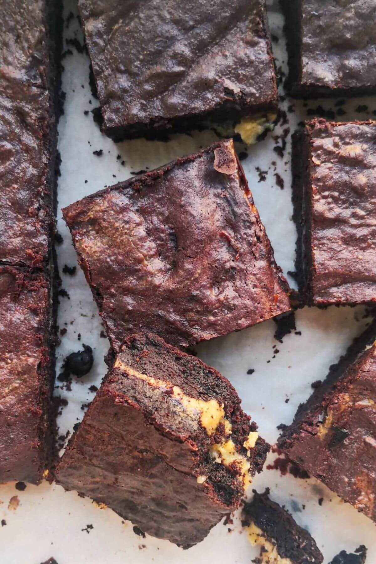 Sliced salted caramel brownies, with one brownie with a bite out of it.