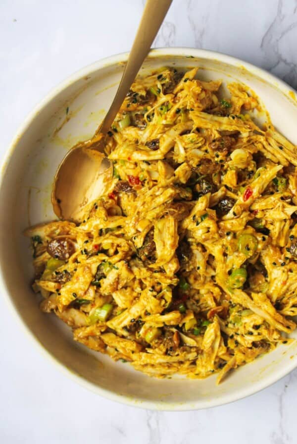 Coronation chicken mixed in a small white bowl.