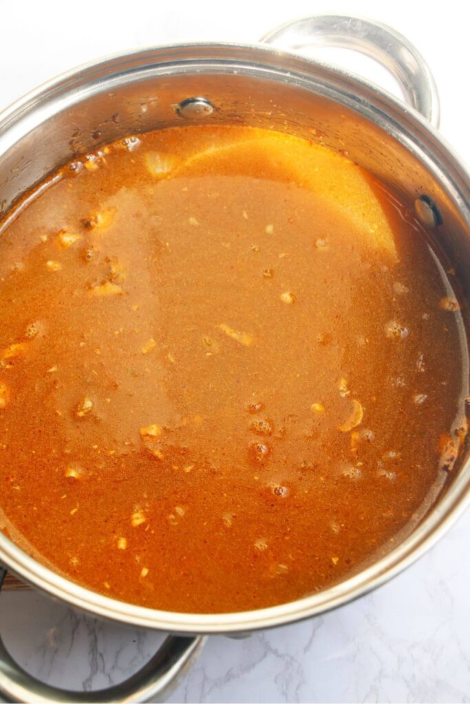 Katsu sauce in a small silver pot, before reducing.