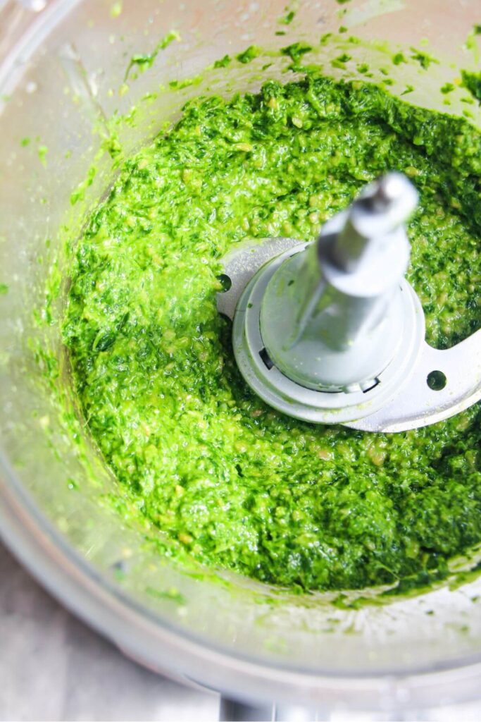 Bright green wild garlic pesto blitzed in a food processor.