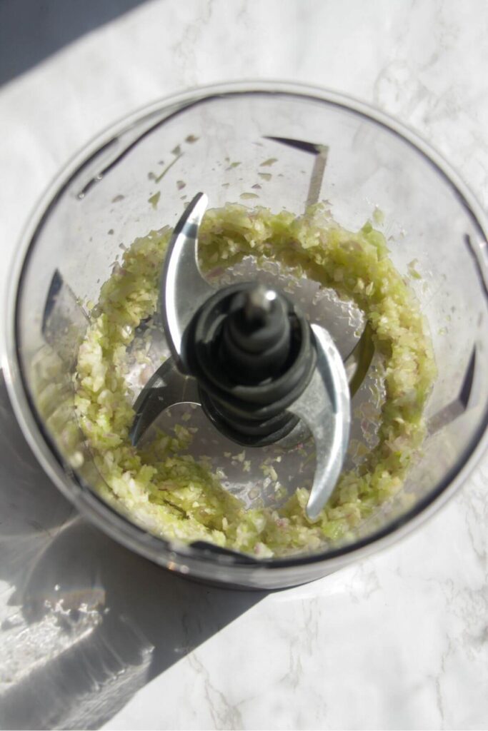 Finely diced onion, garlic and celery in a small food chopper.