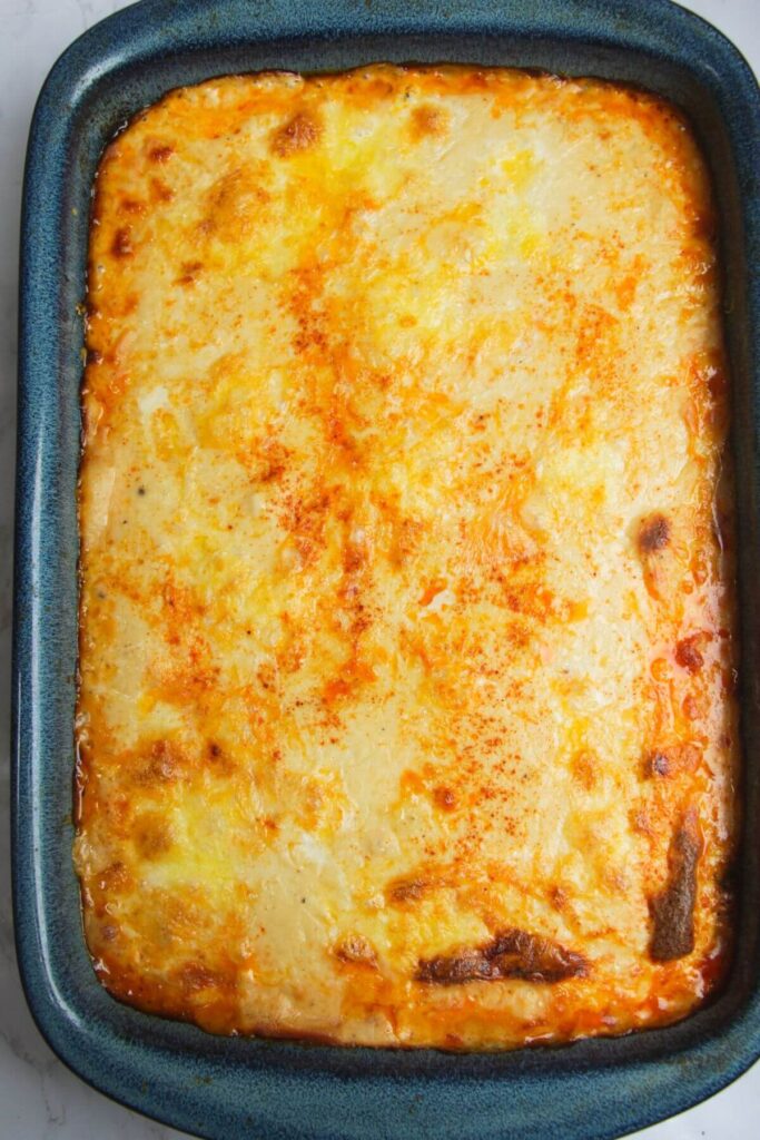 Golden cheese topped bolognese rice bake out of the oven.