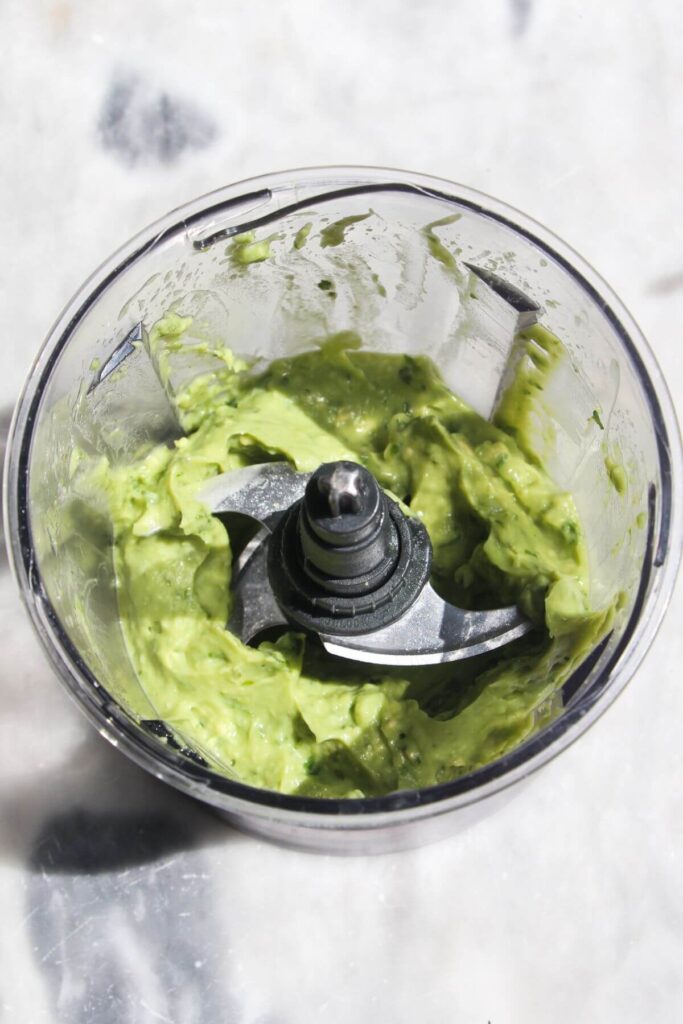 Whipped avocado in a small food processor.
