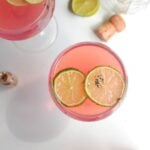 2 pink barbie spritz drinks in coupe's, view from above.