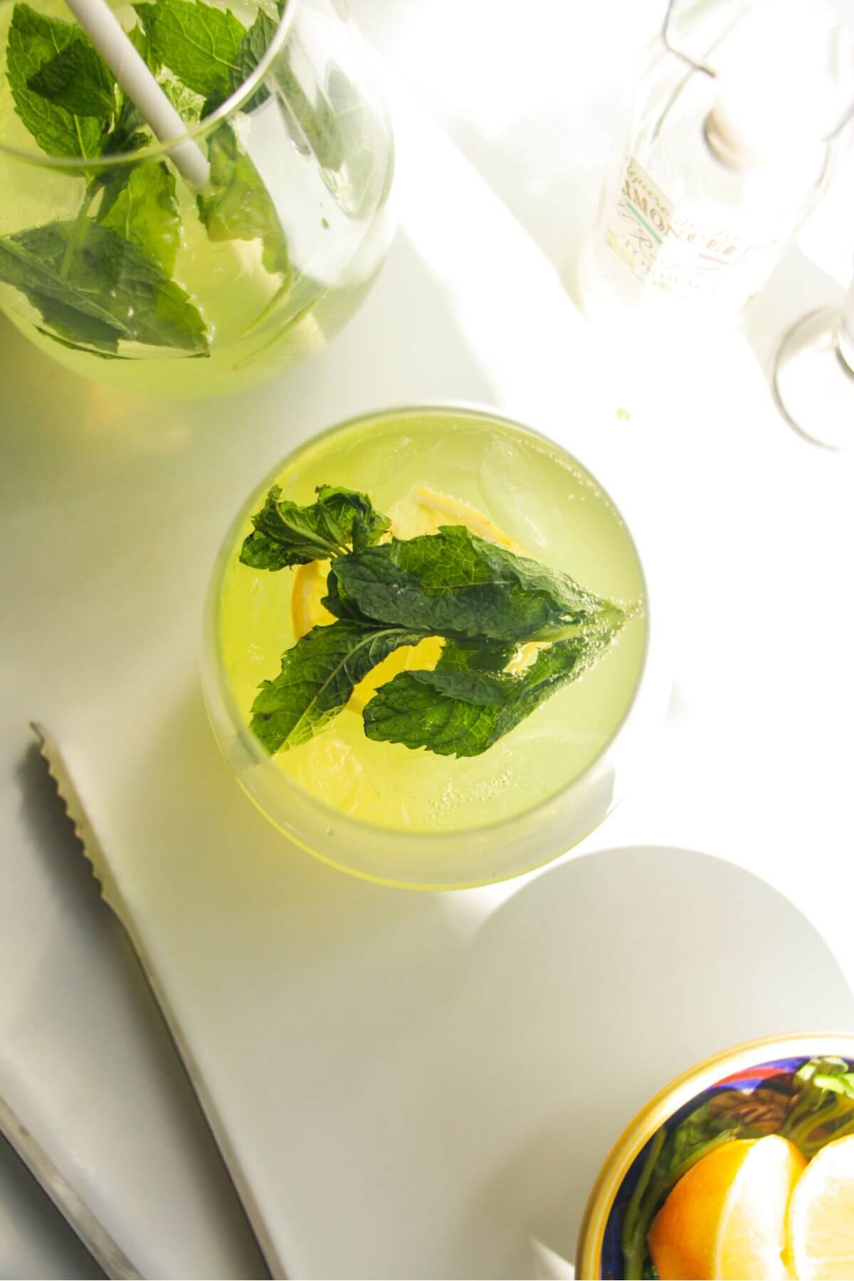 Limoncello spritz with mint leaves, from above.