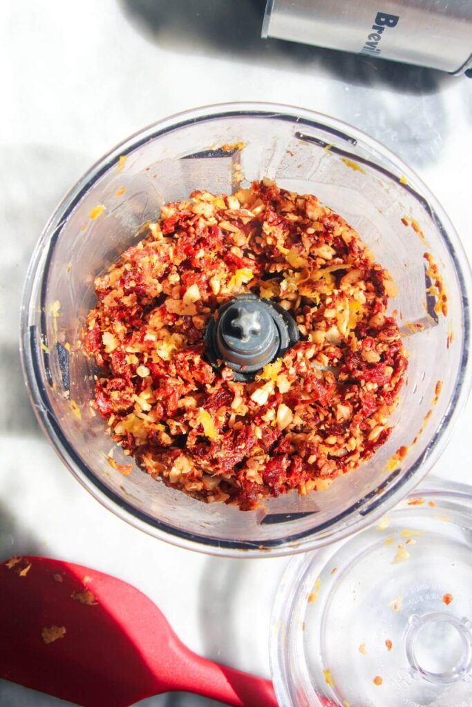 Sun dried tomatoes, almonds and parmesan chopped in a small food chopper.