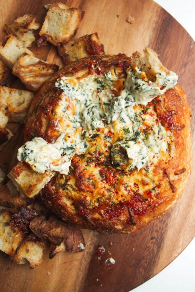 Cheesy spinach dip in a bread bowl.