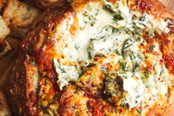 Cheesy spinach dip in a bread bowl.