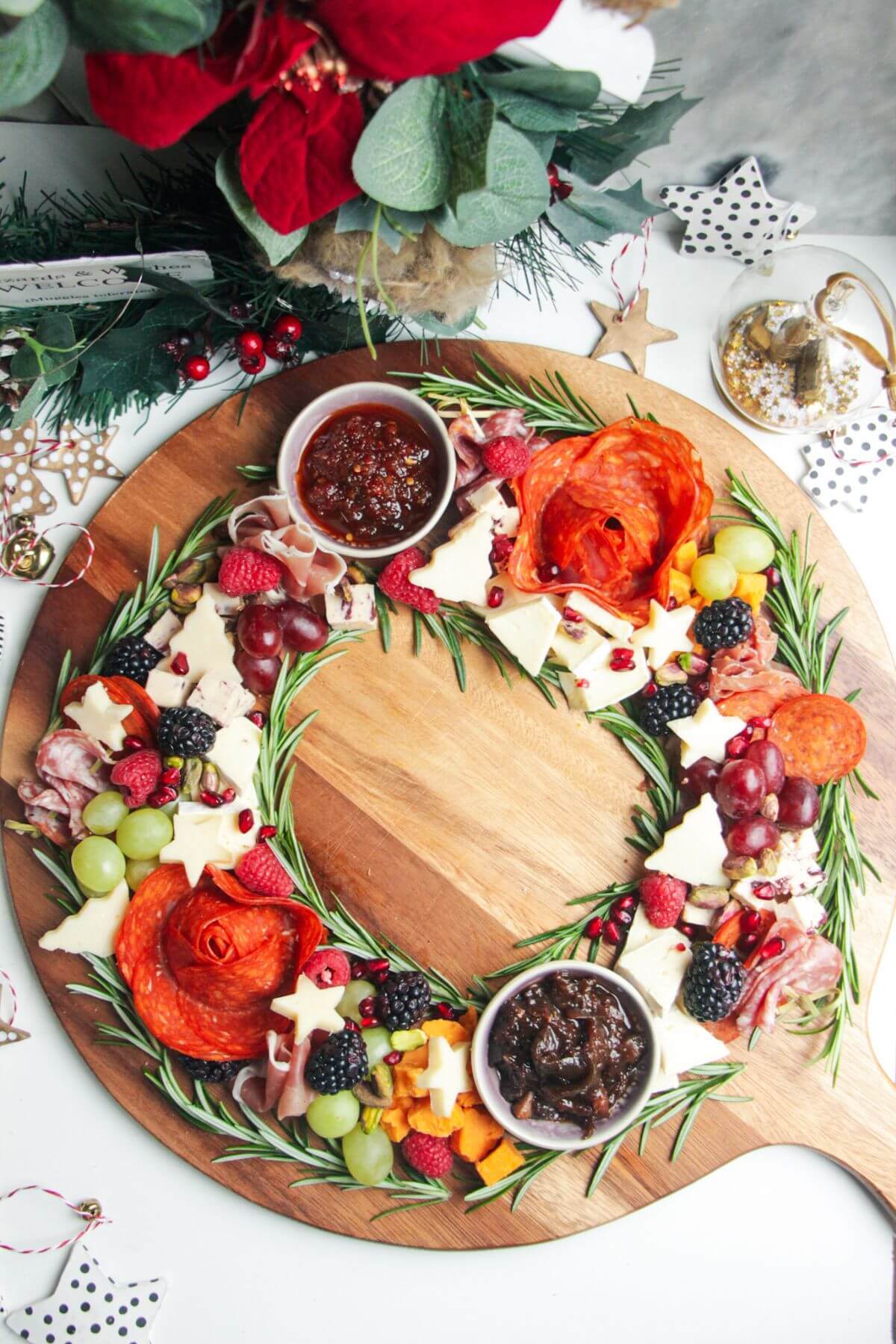 Charcuterie wreath with cured meat, cheeses, chutney.