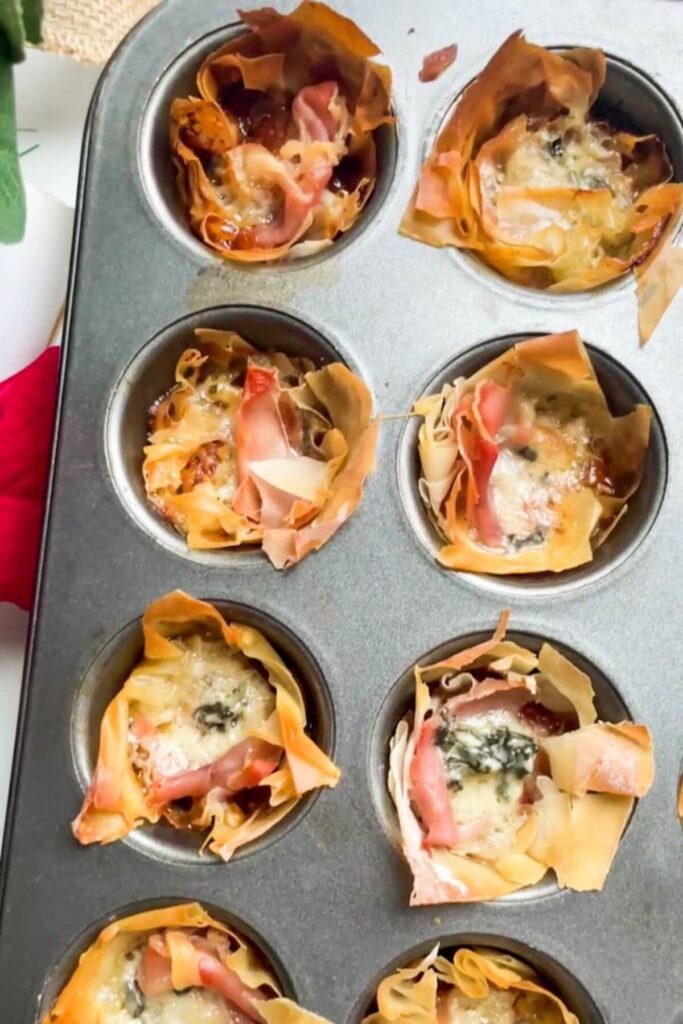 Baked blue cheese, prosciutto, sweet chilli bites in a mini muffin tin.