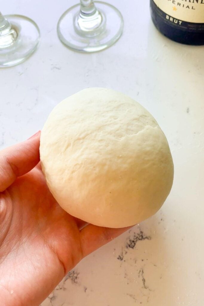 Smooth kneaded dough in hand.