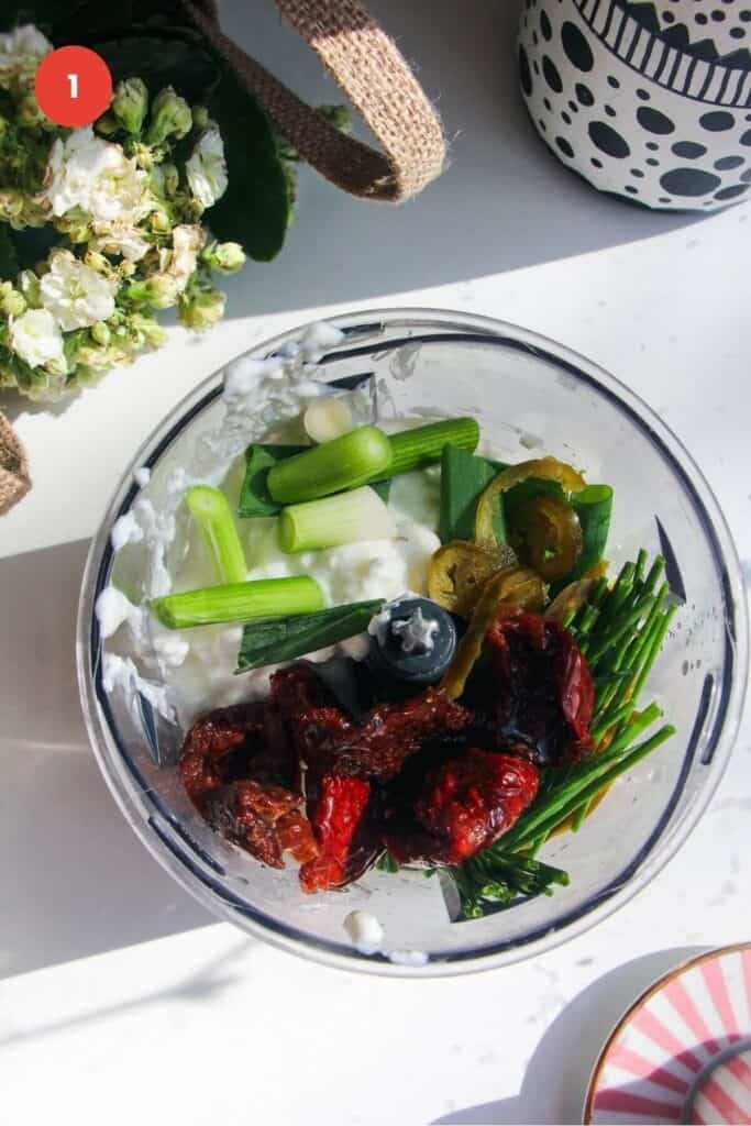 Ingredients for cottage cheese dip in small food chopper.