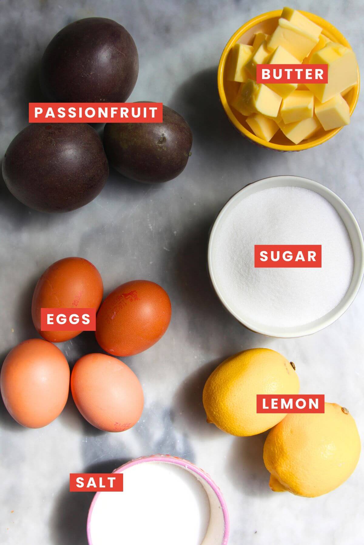 Ingredients for lemon passionfruit curd laid out and labelled.