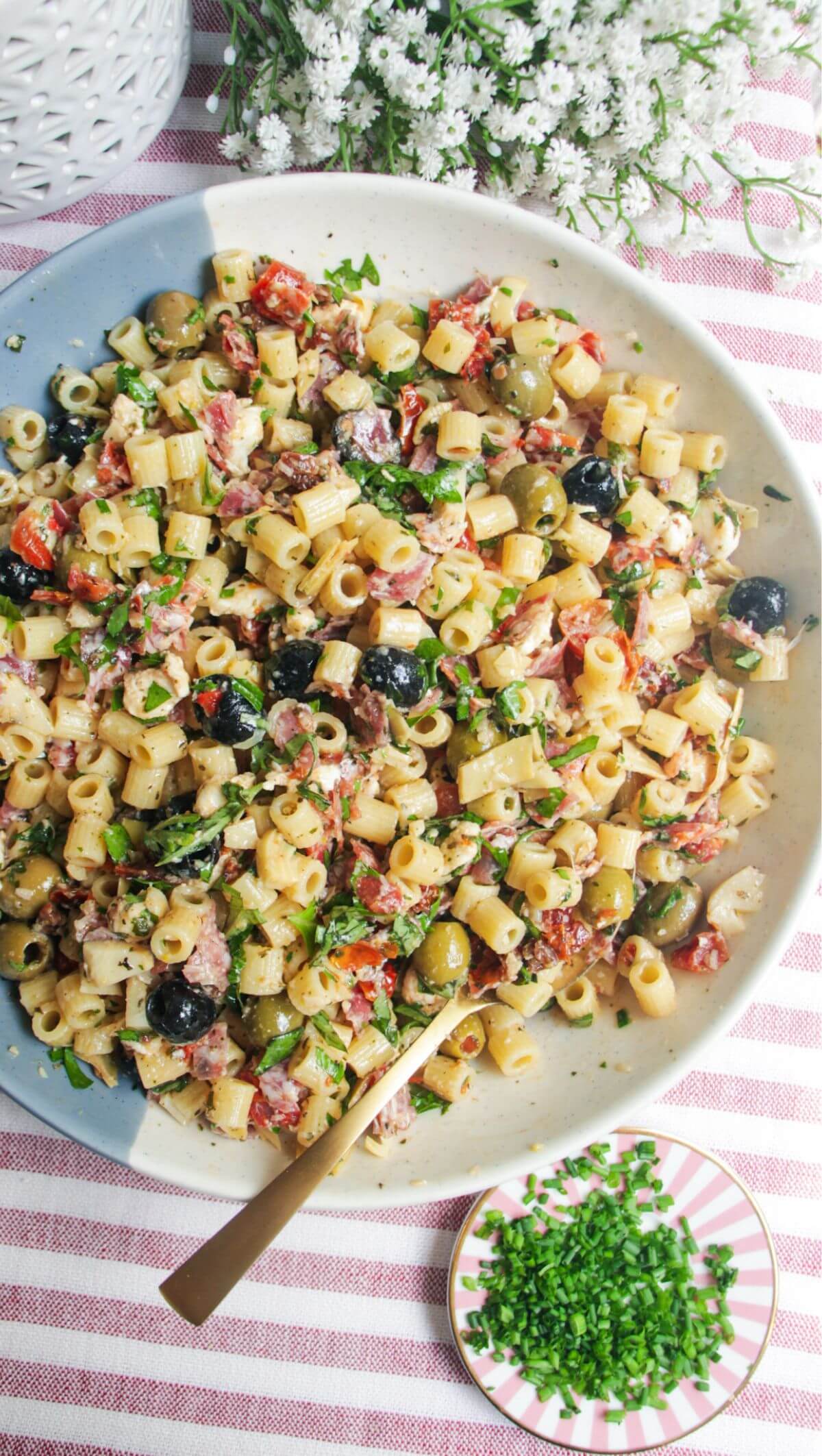 Italian deli antipasti pasta salad in a large serving bowl.