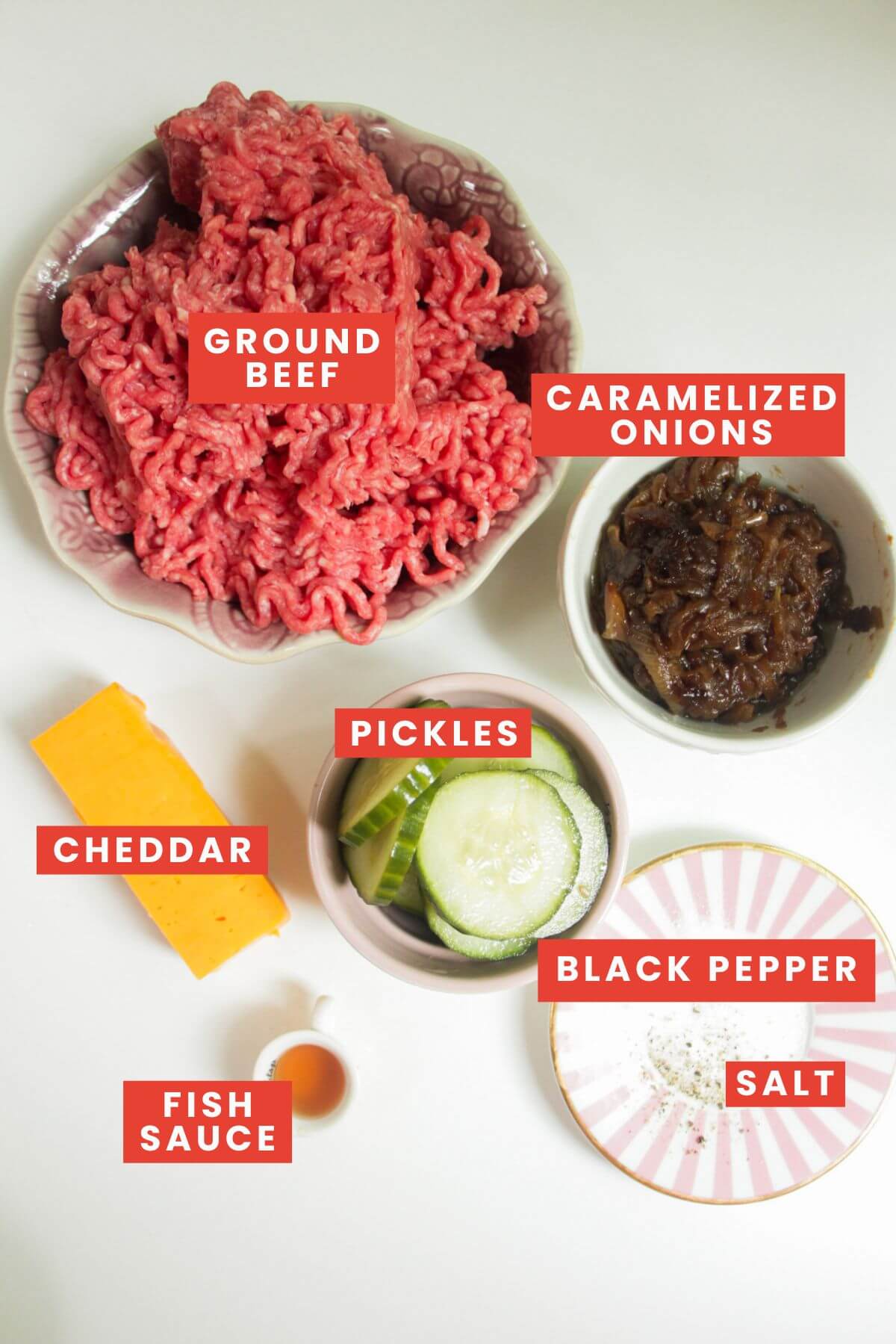 Ingredients for cheeseburger dumplings laid out and labelled.