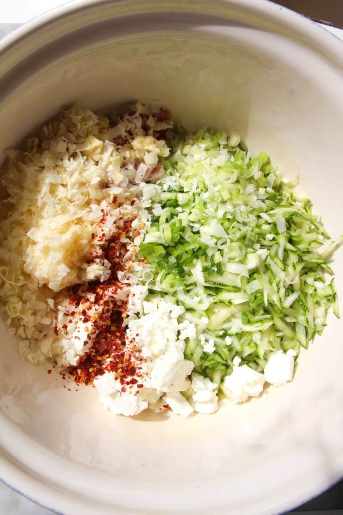Ingredients for zucchini bread in a large mixing bowl.