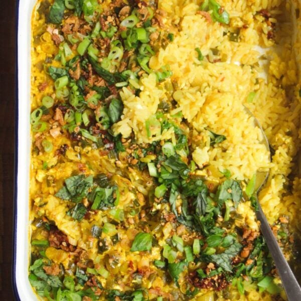 Baked rice topped with scallions and chilli oil.