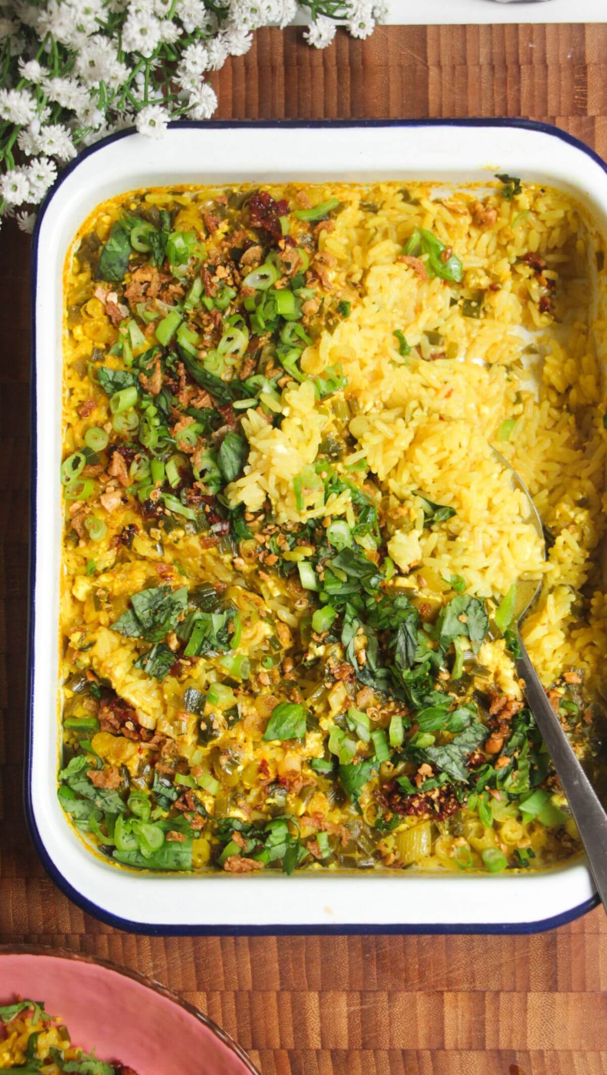 Baked rice topped with scallions and chilli oil.