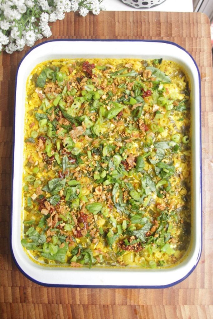 Baked rice topped with scallions and chilli oil.