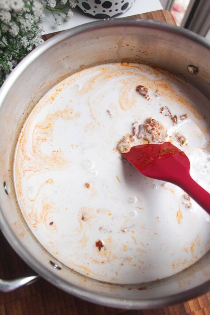 Coconut milk added to pot.