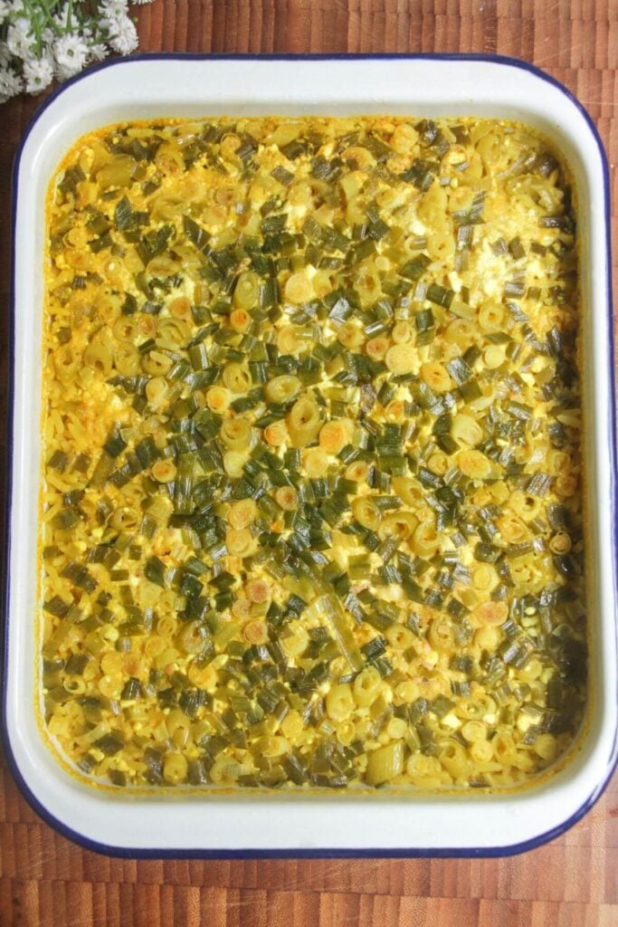 Baked loaded rice in a white tin.
