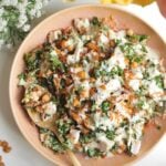 Caesar crispy rice salad in a pink bowl.