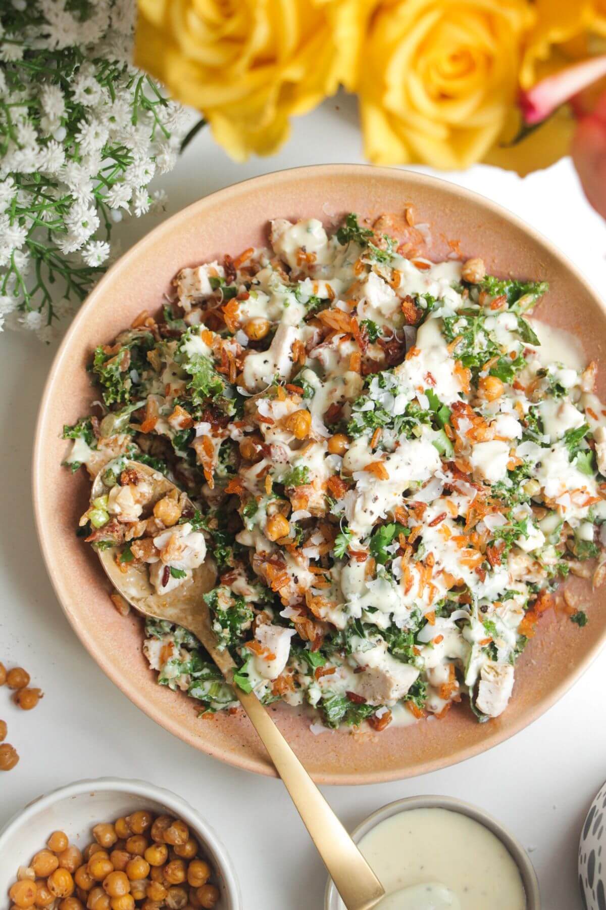 Caesar crispy rice salad in a pink bowl.