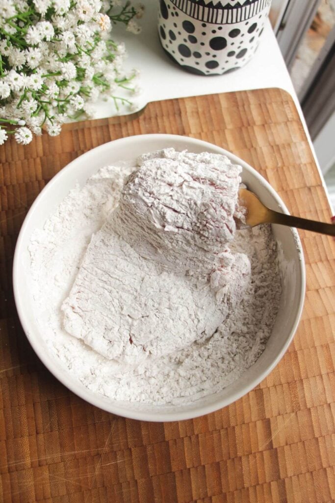 Chicken breast dipped in cornstarch.