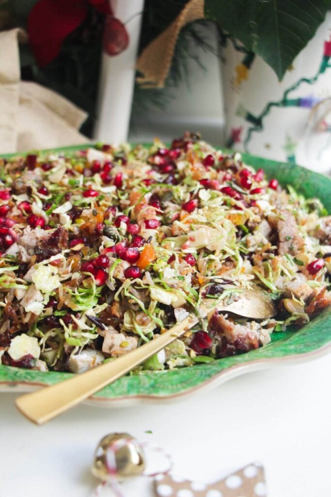 Festive crispy rice salad on a large green platter.