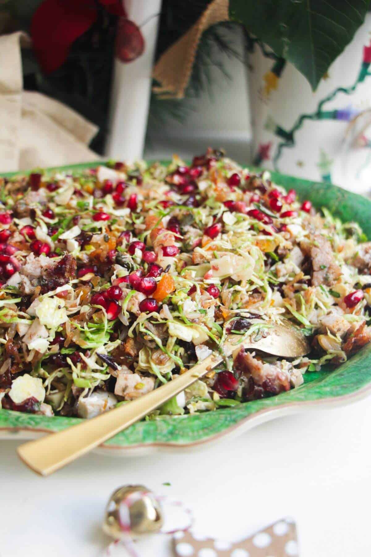 Festive crispy rice salad on a large green platter.
