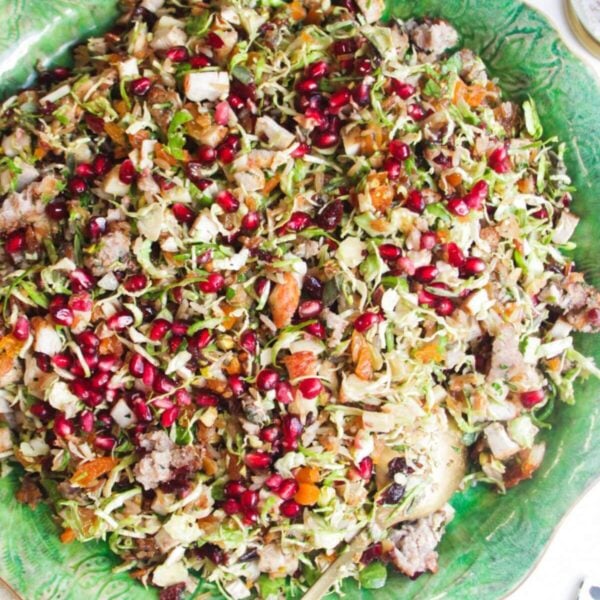 Festive crispy rice salad on a large green platter.