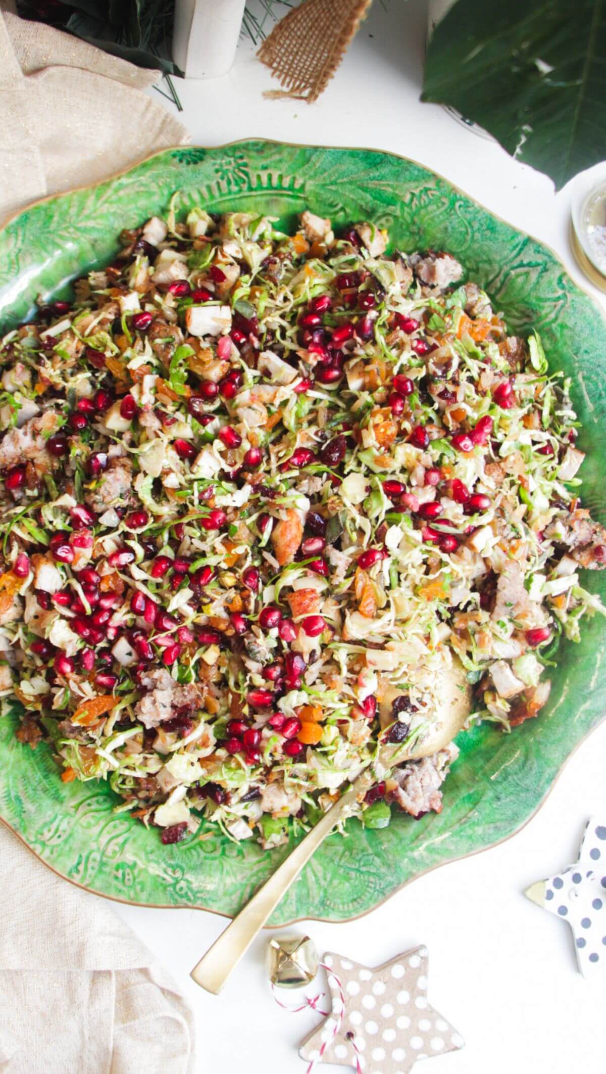 Festive crispy rice salad on a large green platter.