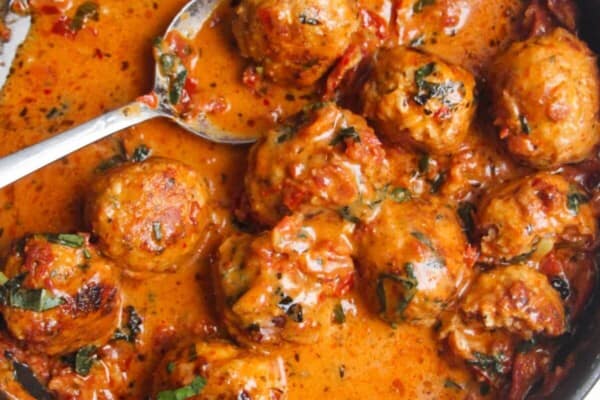 'Marry Me' chicken meatballs in sundried tomato sauce in a small pan.