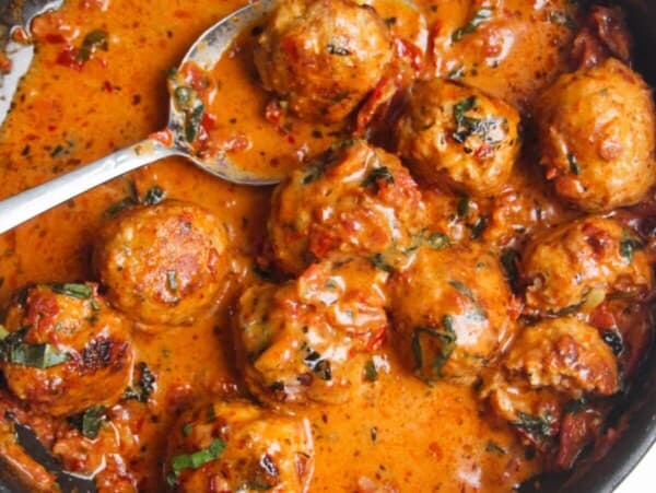 'Marry Me' chicken meatballs in sundried tomato sauce in a small pan.