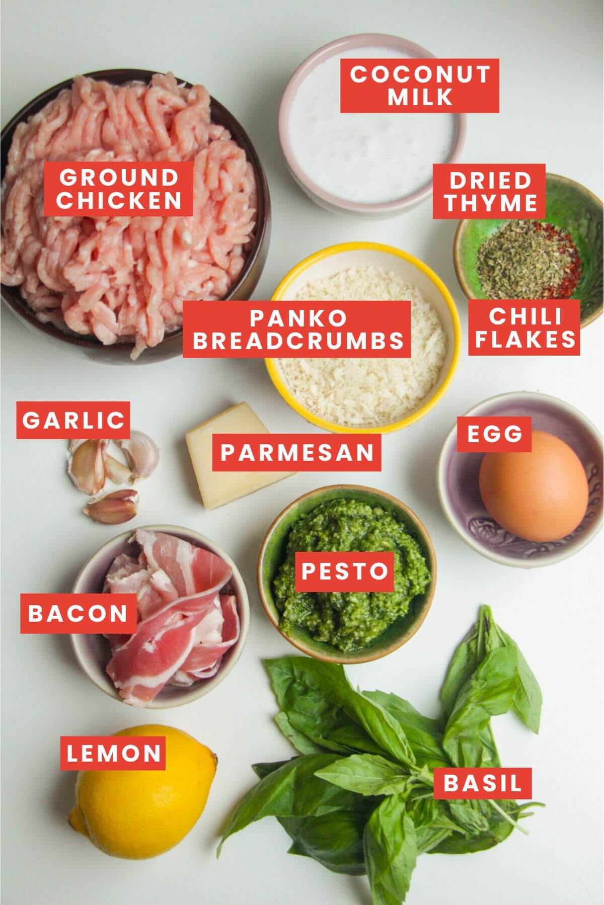 Ingredients for chicken pesto meatballs laid out and labelled.
