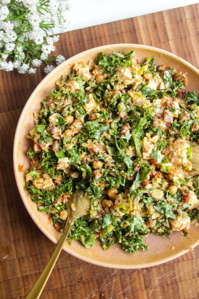 Chicken Caesar rice salad mixed in a bowl.