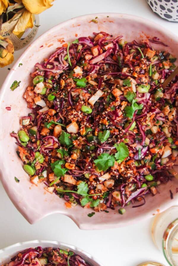 Korean grilled chicken crispy rice salad in a large pink bowl.