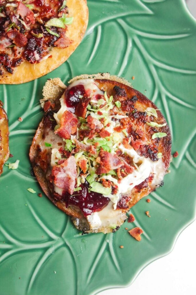 Festive taco topped with bacon, cranberry sauce and brussel sprouts.