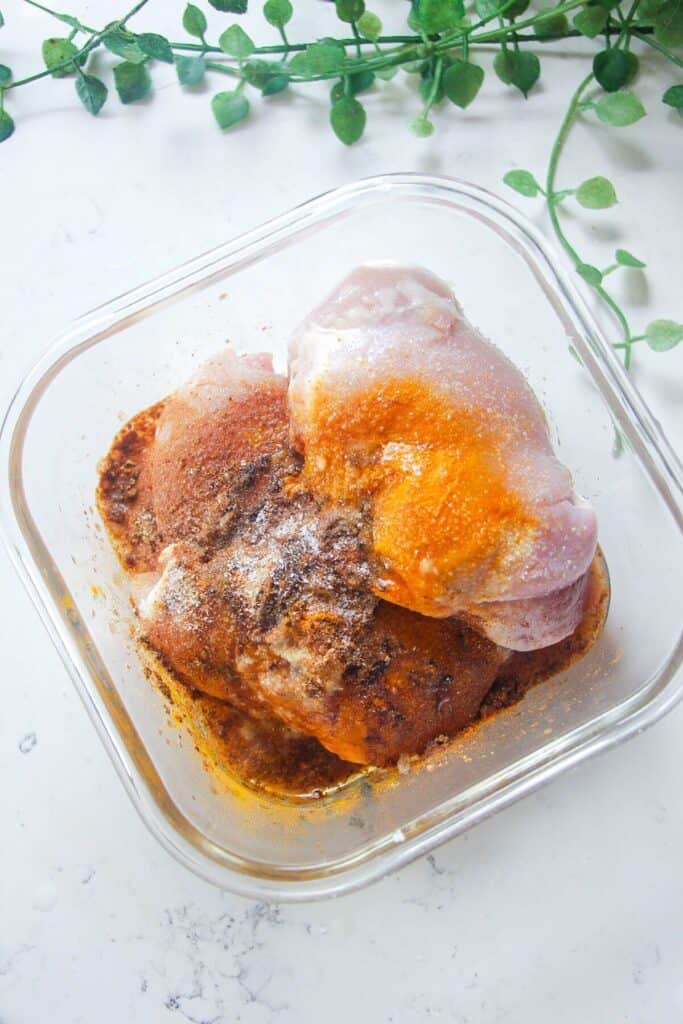 Chicken thighs in shawarma marinade.