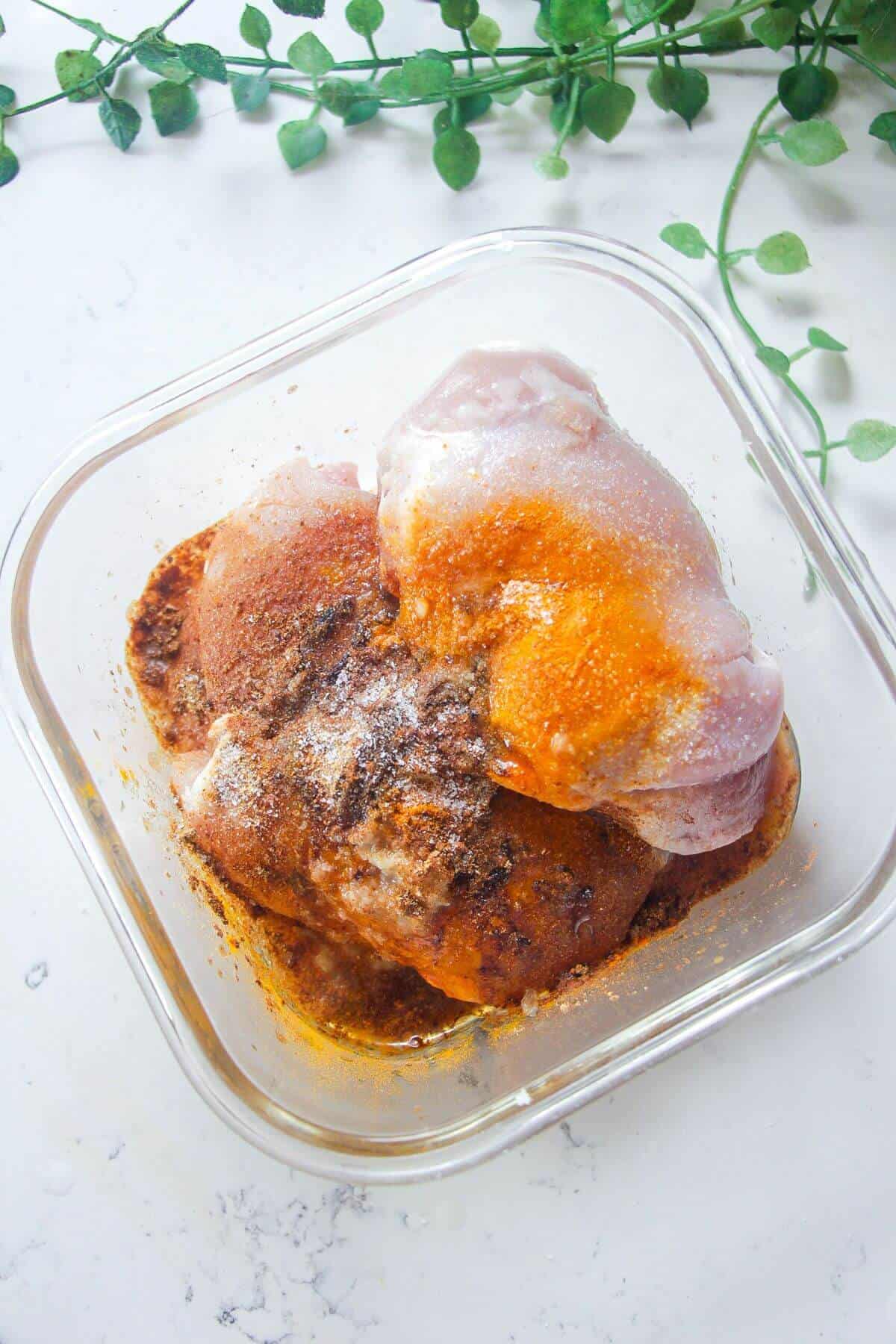 Chicken thighs in shawarma marinade.