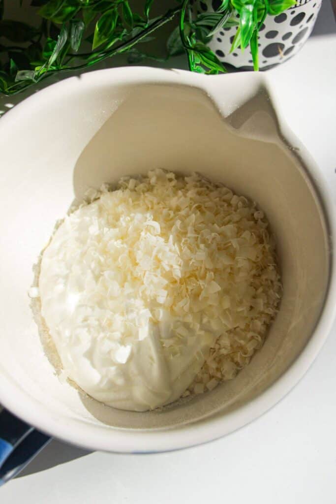 Ingredients for cottage cheese gnocchi in a mixing bowl.
